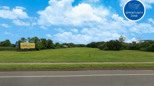 Aerial view of a 9.25-acre level industrial lot at 250 Lordship Boulevard in Stratford, CT, highlighting its 450 feet of frontage and proximity to the I-95 highway exit.
