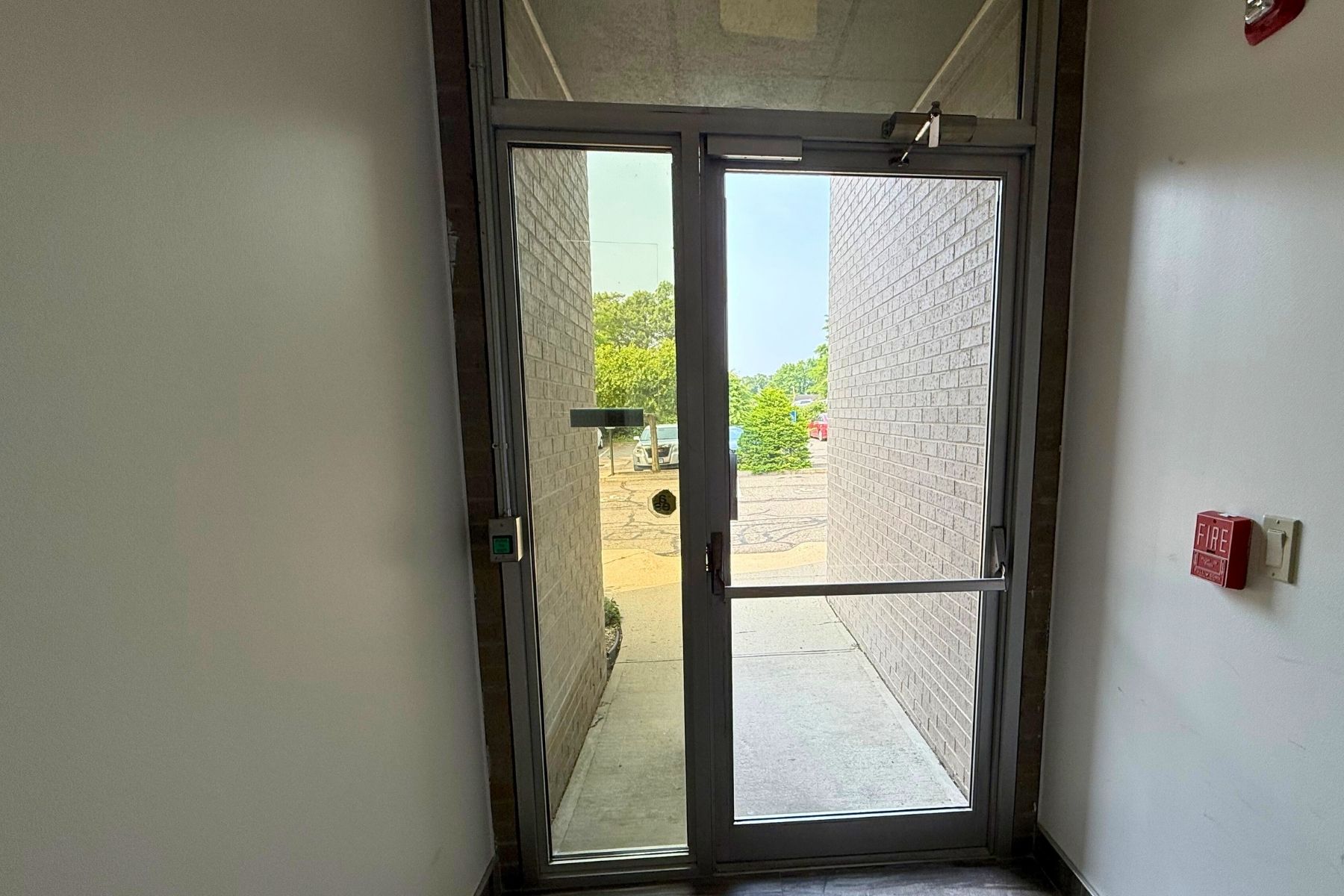 Suite 120 - Glass-Paneled Side Entrance Provides Immediate Access to Suite Suite 120 - Glass-Paneled Side Entrance Provides Immediate Access to Suite