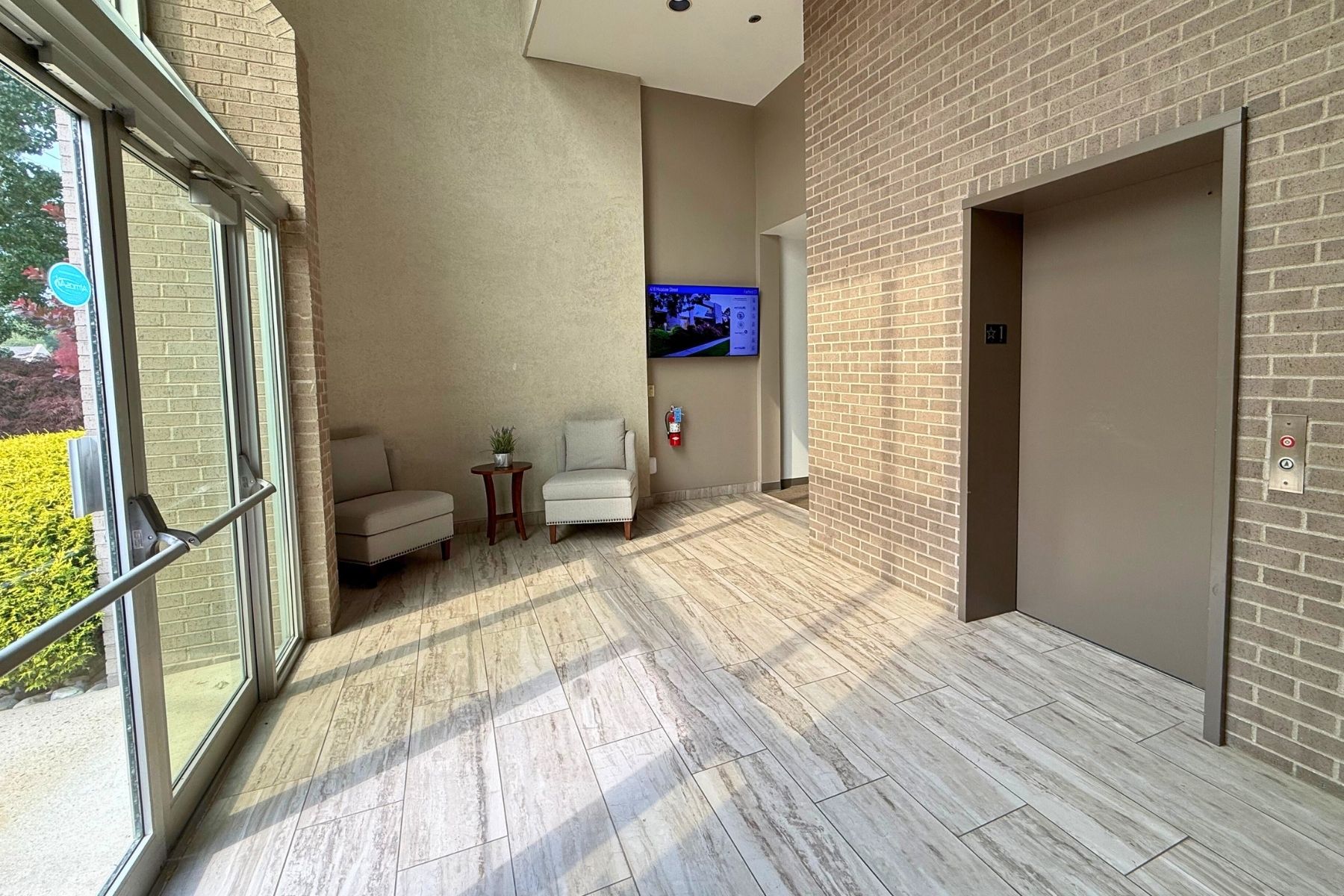 Professional Multi-Tenant Building Entrance Featuring A Digital Directory And AtmosAir™ Environmental Purification Professional Multi-Tenant Building Entrance Featuring A Digital Directory And AtmosAir™ Environmental Purification