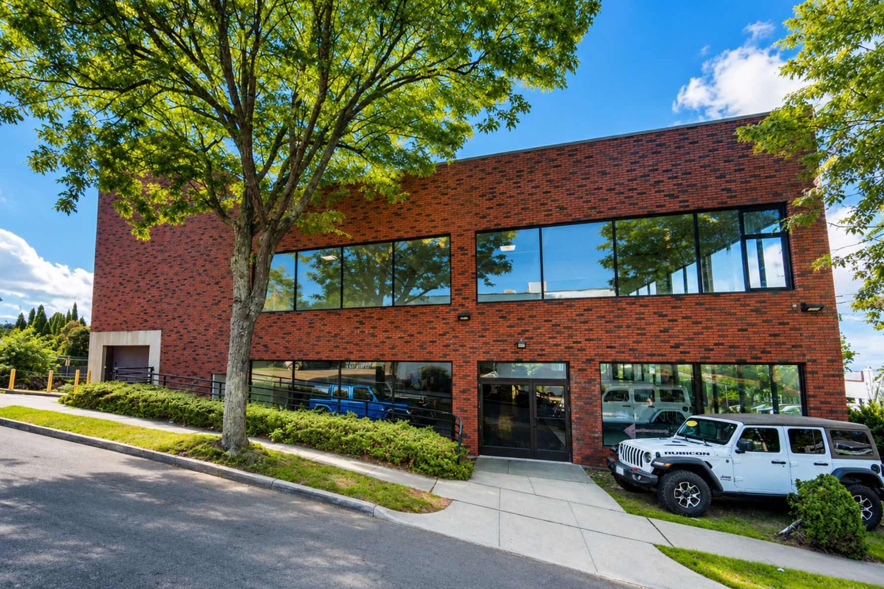 Dedicated Showroom Entrance and Drive-In Door on Marlborough Terrace Side Exterior View Featuring A Dedicated Showroom Entrance And Drive-In Door