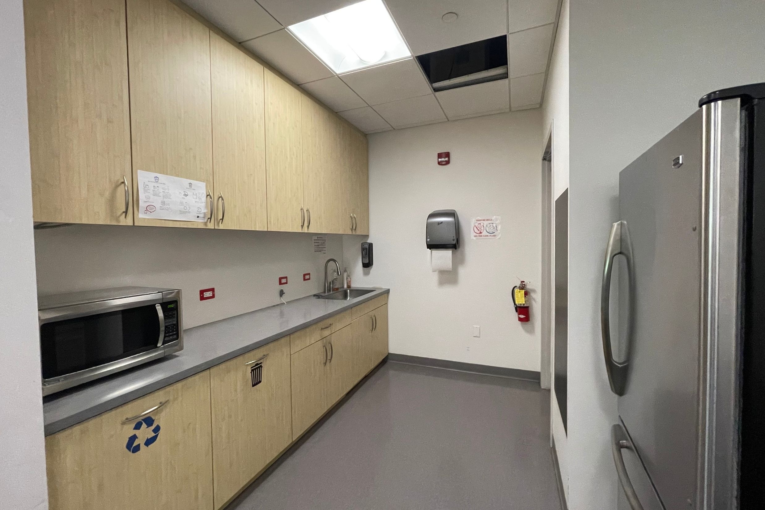 Modern Office Kitchenette - 501 Kings Highway East Modern office pantry and kitchenette area with cabinetry and prep space for employee use.