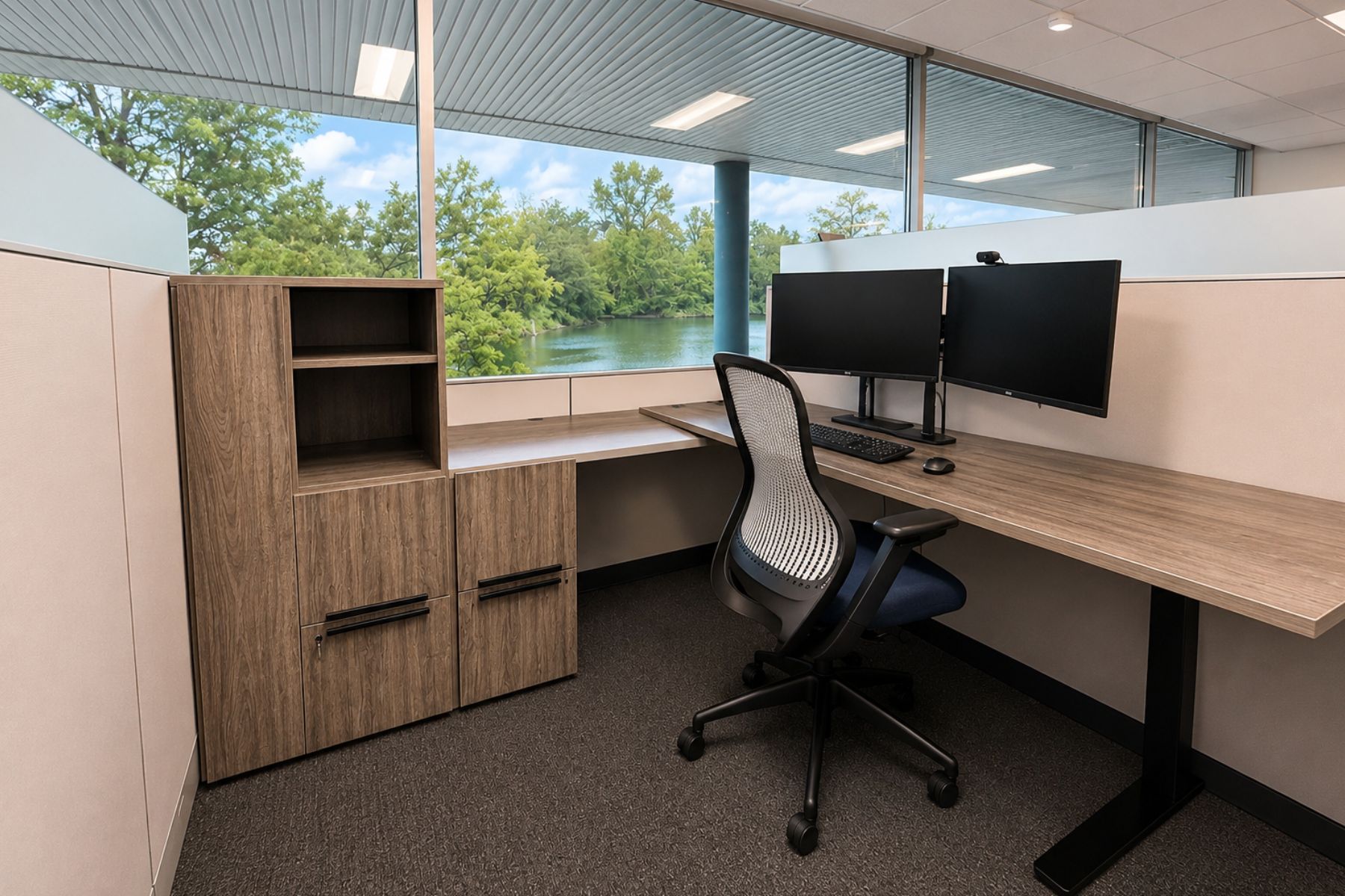 First Floor Suite - 19 Electric Sit/Stand Desks Available From Tenant Commercial office workspace at One Post Road in Fairfield, CT, featuring abundant natural light, water views of Ash Creek, and electric sit-stand desks.