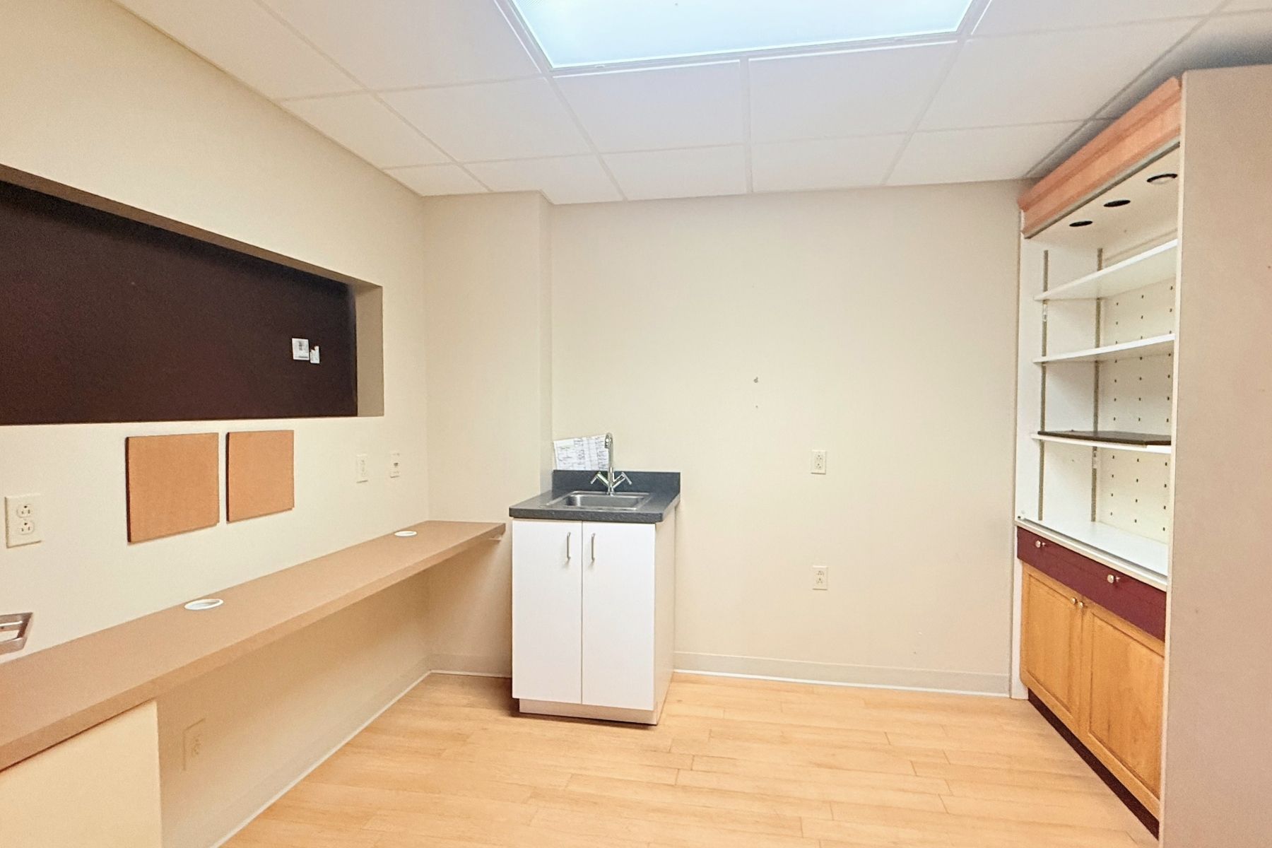 Plumbed for Medical Use with Seven Sinks Interior of a medical office exam room plumbed with a handwashing sink and laminate countertops at Hawley Lane Professional Center in Trumbull, CT