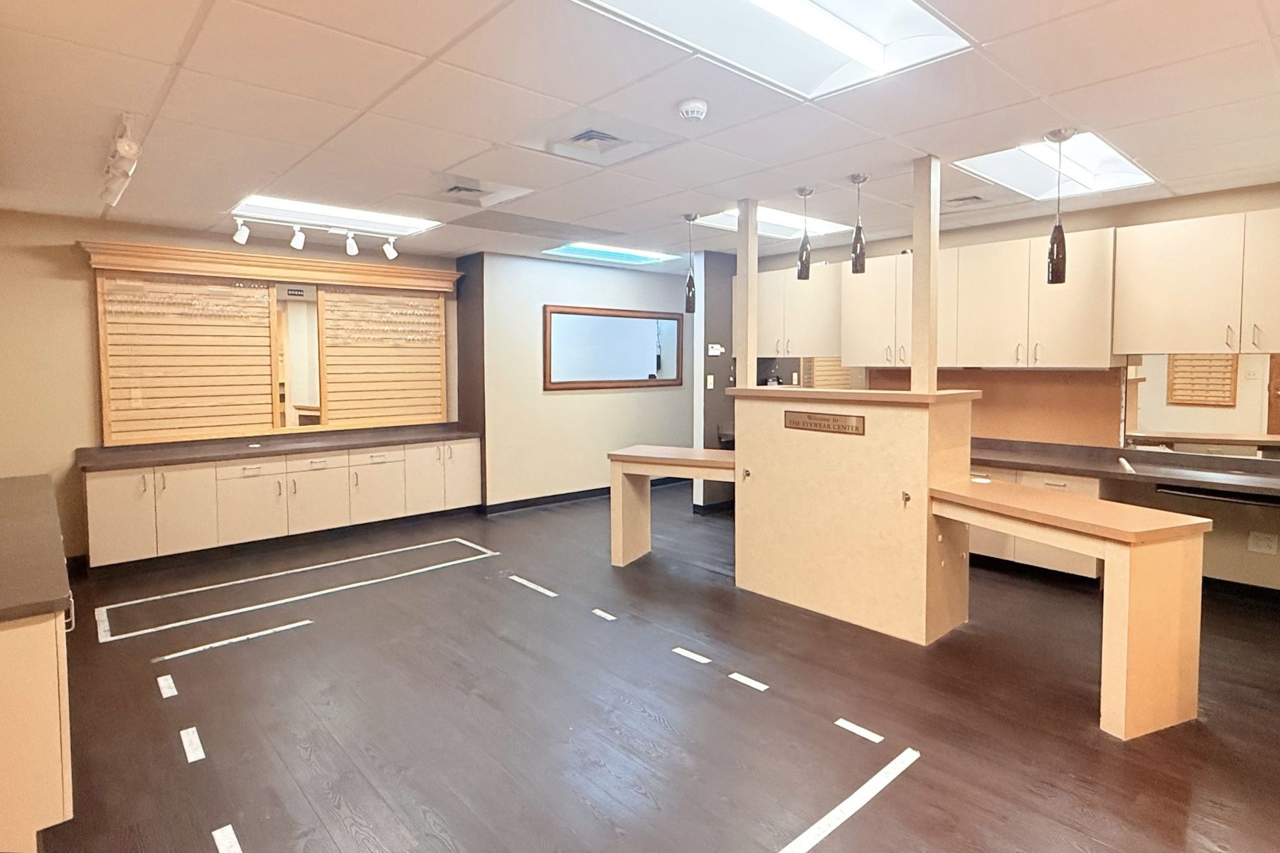Retail Area Interior commercial space featuring custom built-in cabinetry, reception counters, and a display area at Hawley Lane Professional Center in Trumbull, CT