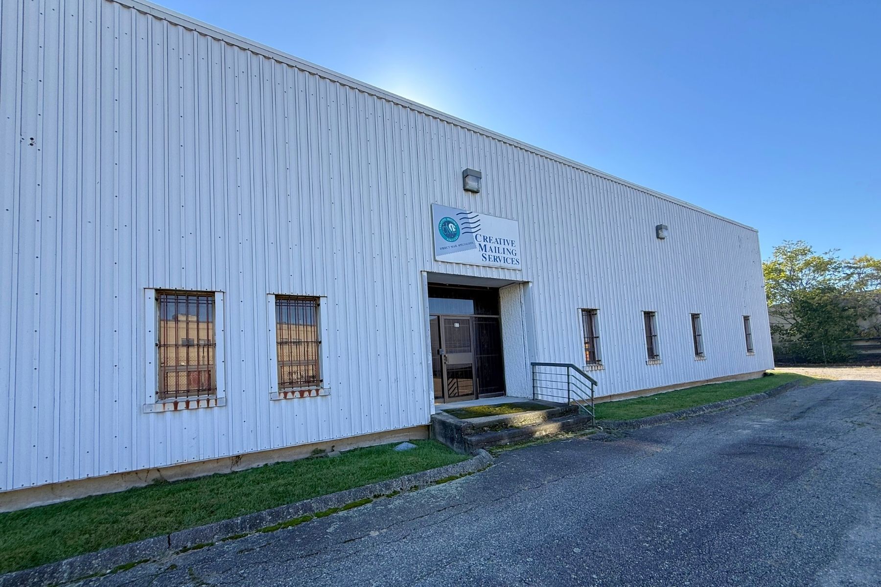 Additional Entrance to Warehouse in Rear Main Entrance to One-Story Building on Fully Gated Lot