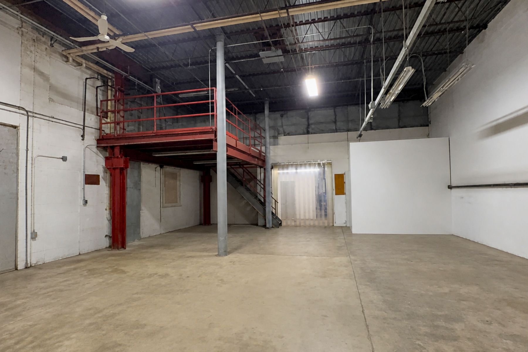 One of Two Mezzanines Provide Additional Storage One of Two Mezzanines Provide Additional Storage