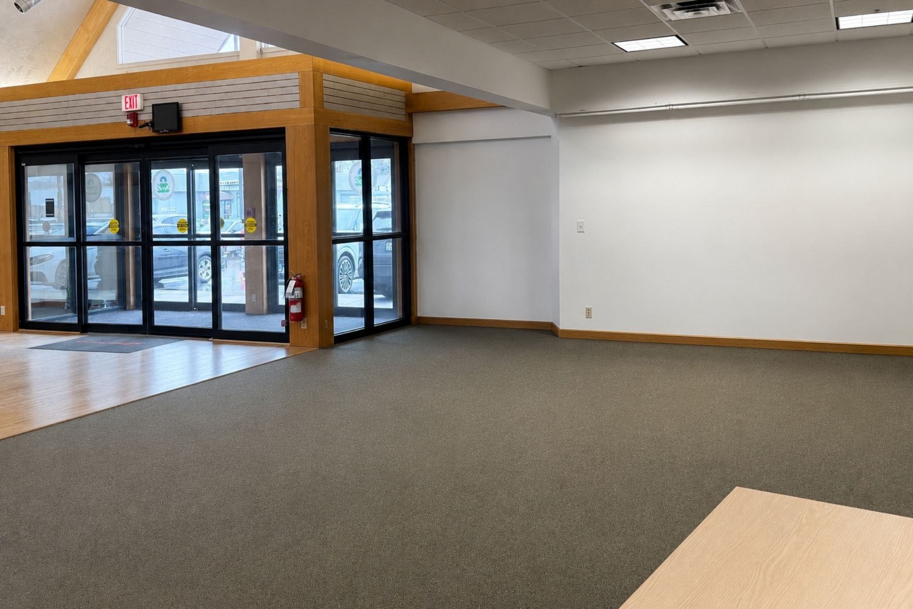 Expansive Open-Concept Showroom Floor Easily Reconfigurable for High-Volume Retail Large open-concept showroom floor arranged with rows of red chairs for a seminar or presentation layout.