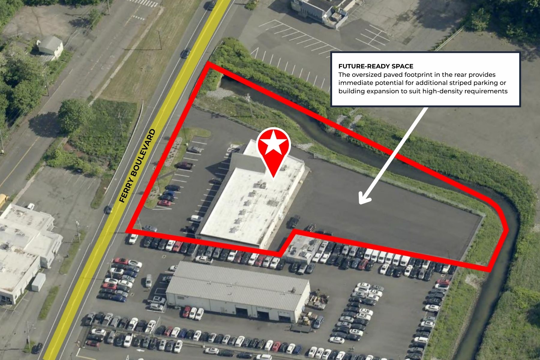 Superior Parking & Logistical Flexibility Aerial site map view highlighting the building perimeter, front parking layout, and expansive rear parking lot.