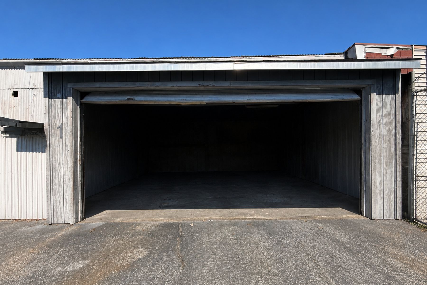 Functional Warehouse Space Featuring an Oversized Garage Door for Easy Equipment Loading Oversized drive-in garage door for equipment loading at 120 Silliman Avenue industrial warehouse in Bridgeport, CT