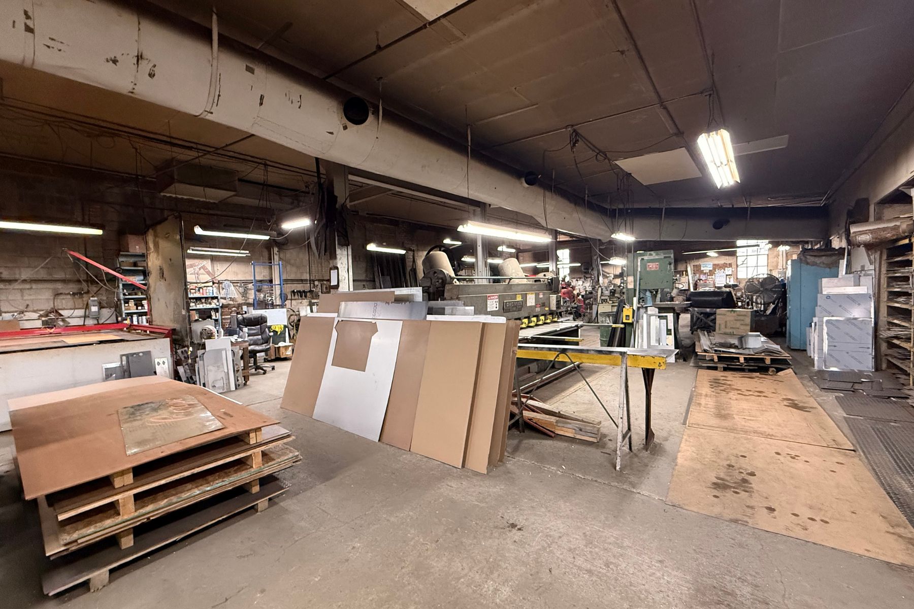 Open-Concept Masonry Floor Plan for Heavy Machinery Open-concept industrial warehouse interior at 120 Silliman Avenue, Bridgeport, CT, featuring masonry walls, concrete flooring, and space for heavy machinery.