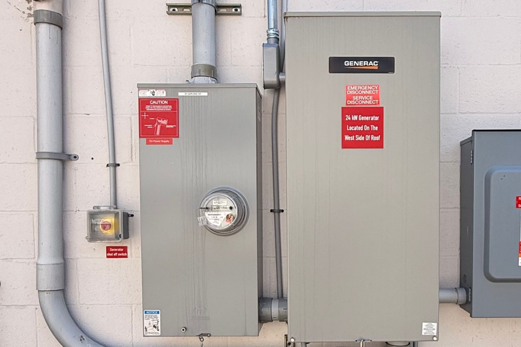 Reliable 24KW Generator Providing Full Backup Power Exterior 24KW Generac standby generator at 20 Garland Drive, Stamford, CT, providing full backup power and operational continuity for the industrial building.