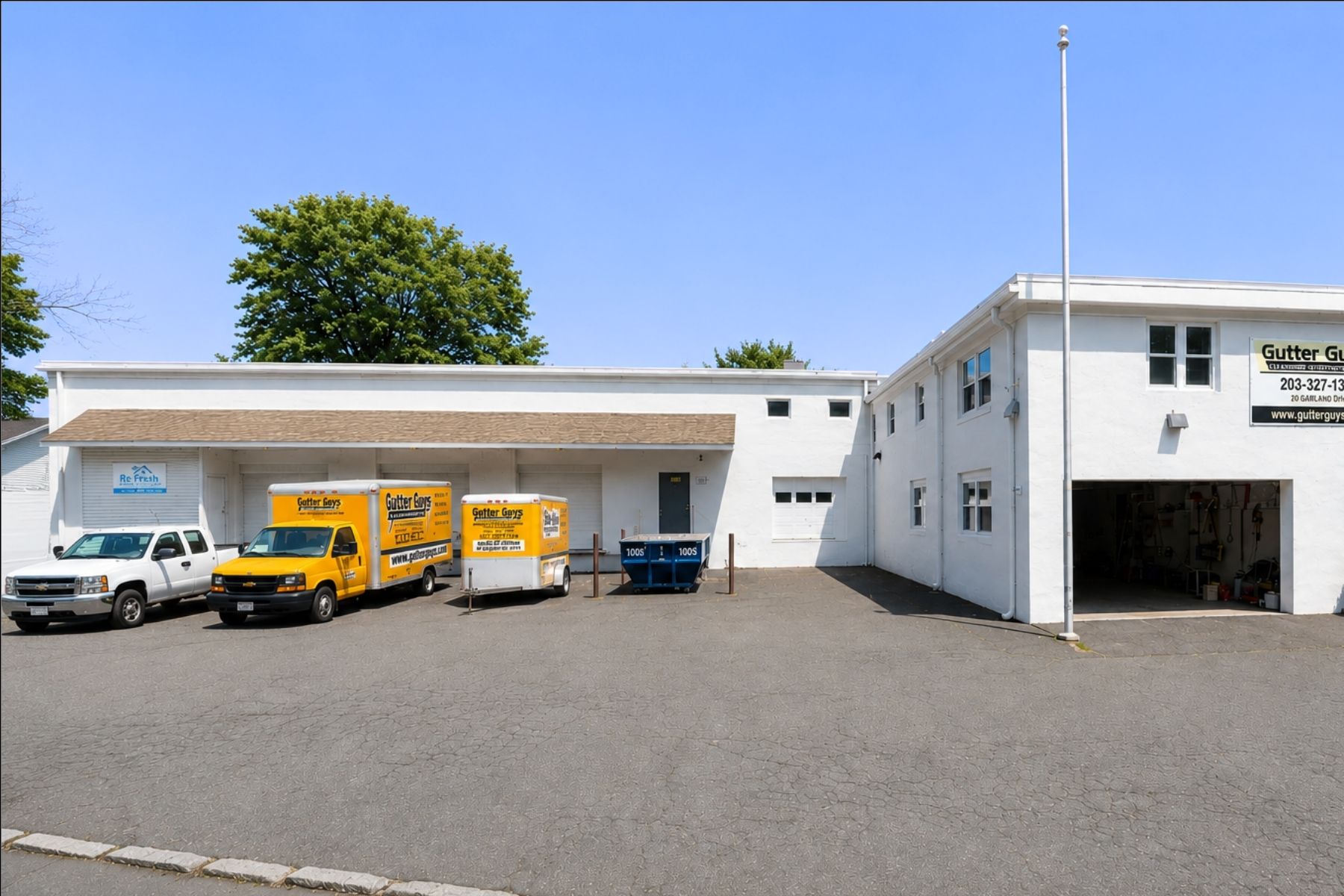 Four Dock-Height Loading Docks and One Drive-In Door Exterior of a commercial building featuring four dock-height loading docks and one drive-in door.