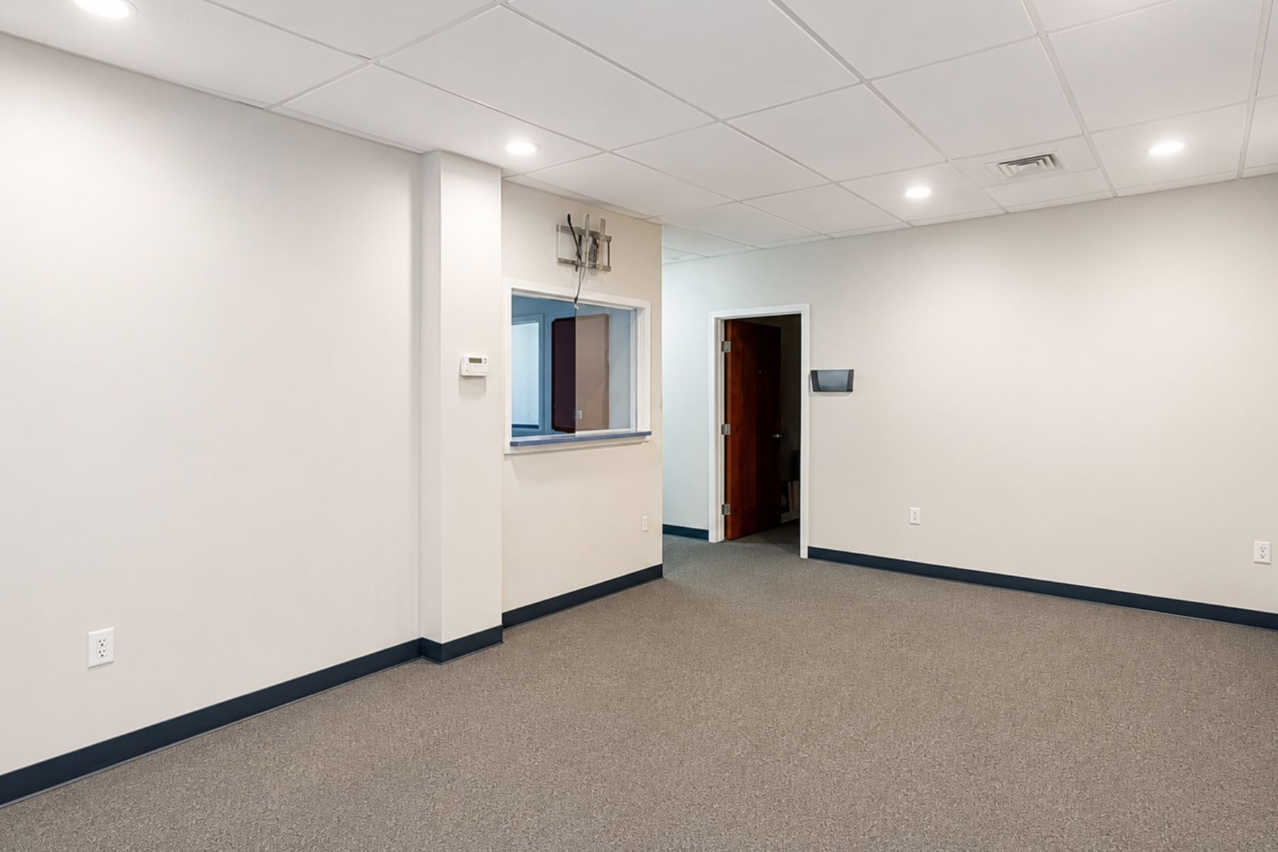 Spacious Waiting Room Spacious medical office waiting room and reception seating area with grey carpeting at Hawley Lane Professional Center in Trumbull, CT.